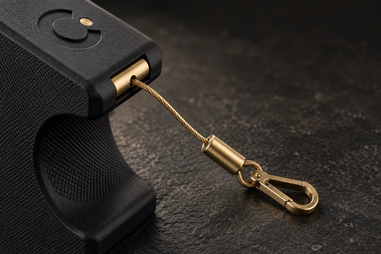 Close-up of the retractable cord and brass swivel clip on the Cinch Loader (concept render)