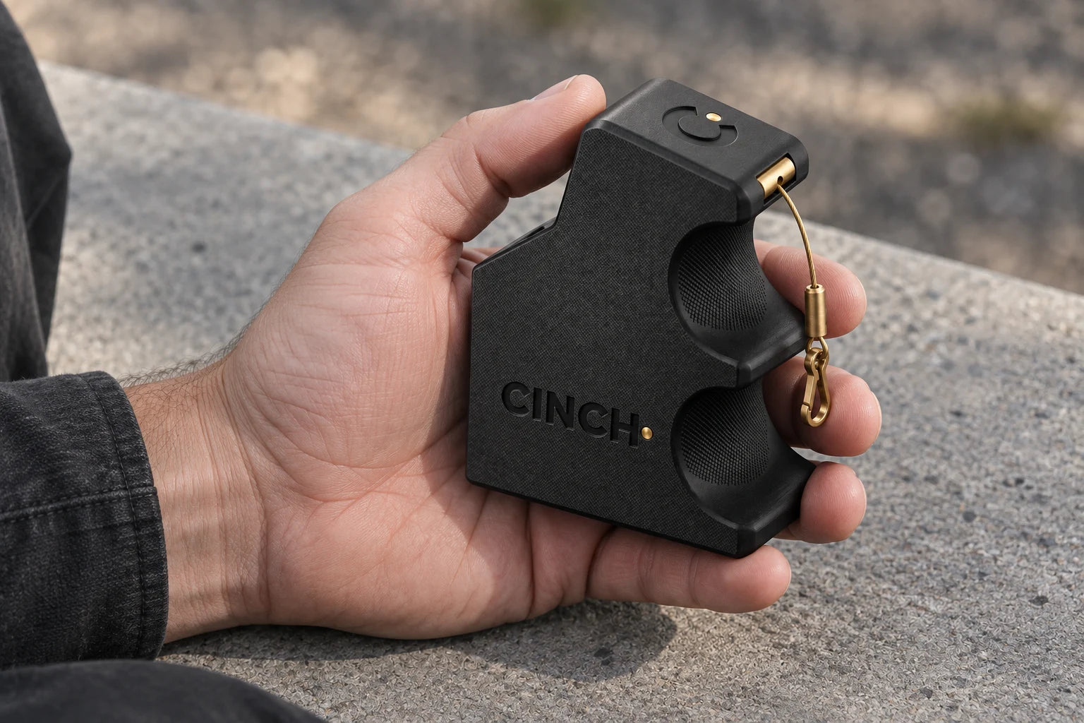 A Cinch Loader resting in one hand (concept render)