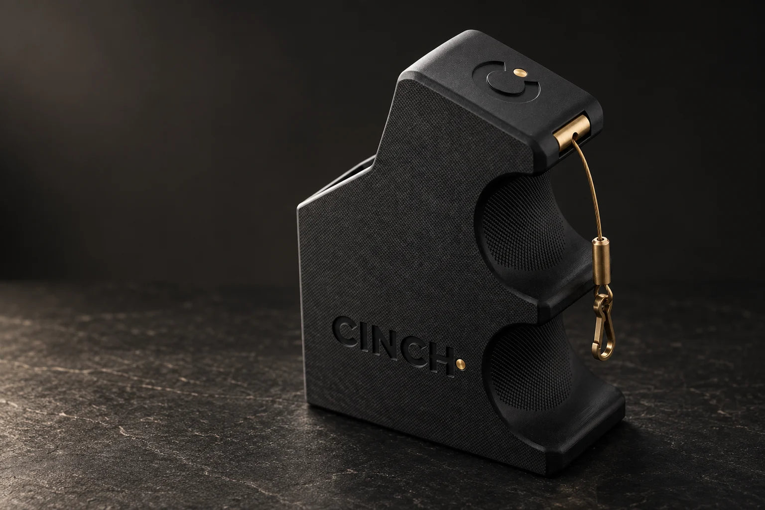 Cinch Loader in matte carbon fiber nylon with its brass swivel clip and retractable tether (concept render)